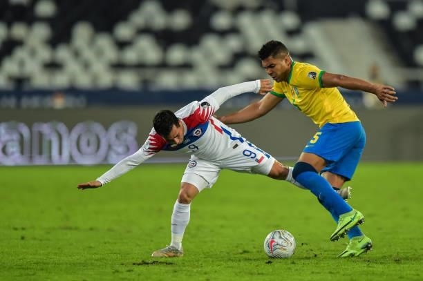 Casemiro player from Brazil disputes a bid with Meneses player from Chile during a match at the Engenhão stadium for the Copa América 2021, on July...