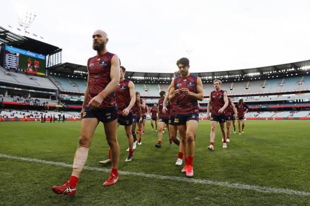 Max Gawn of the Demons leads his team off the ground after a loss during the 2021 AFL Round 16 match between the Melbourne Demons and the GWS Giants...