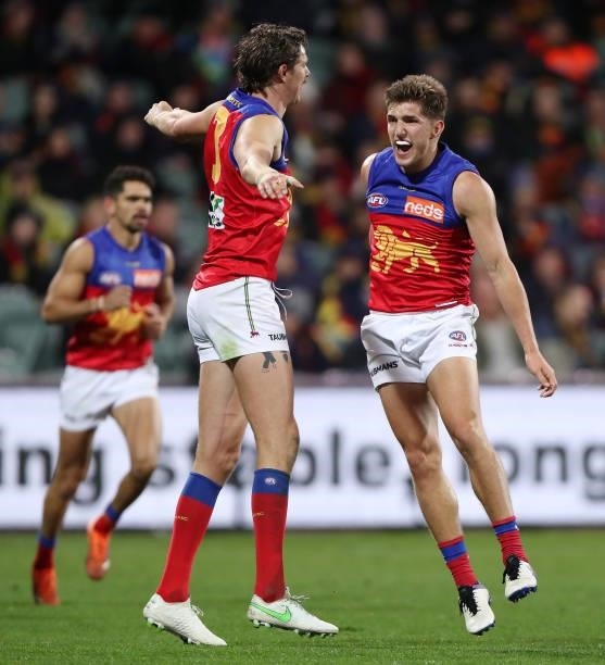 Zac Bailey of the Lions celebrates a goal with Joe Daniher during the 2021 AFL Round 16 match between the Adelaide Crows and the Brisbane Lions at...