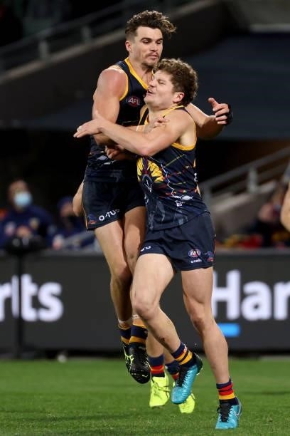 Harry Schoenberg of the Crows celebrates a goal during the 2021 AFL Round 16 match between the Adelaide Crows and the Brisbane Lions at Adelaide Oval...