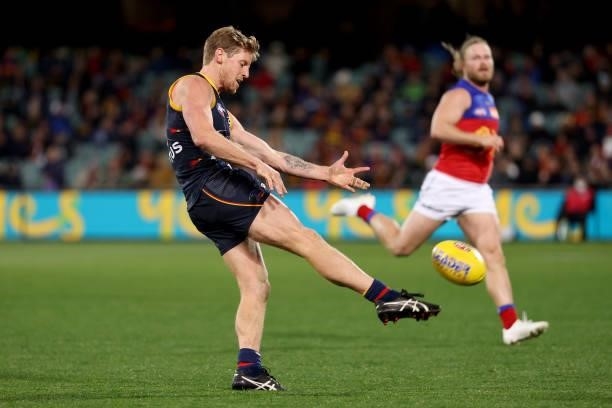 Rory Sloane of the Crows kicks the ball during the 2021 AFL Round 16 match between the Adelaide Crows and the Brisbane Lions at Adelaide Oval on July...