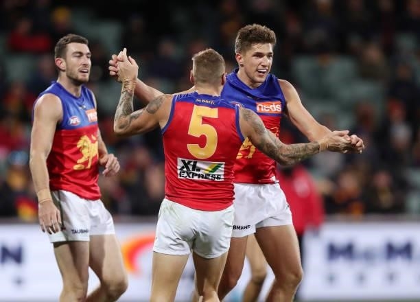 Zac Bailey of the Lions celebrates a goal with Mitch Robinson during the 2021 AFL Round 16 match between the Adelaide Crows and the Brisbane Lions at...