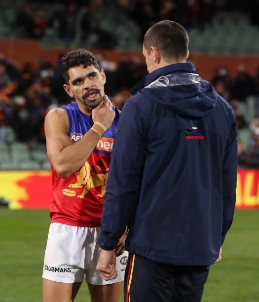 Charlie Cameron of the Lions speaks with Taylor Walker of the Crows after the 2021 AFL Round 16 match between the Adelaide Crows and the Brisbane...