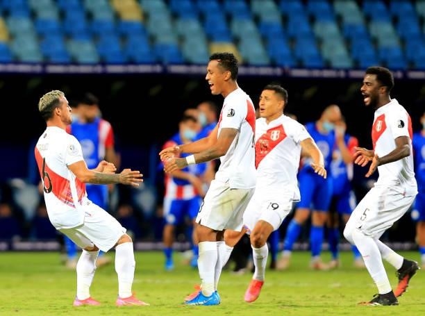 Miguel Trauco of Peru celebrates with his teammates after winning the penalty shootout during the Quarterfinal match between Peru and Paraguay as...