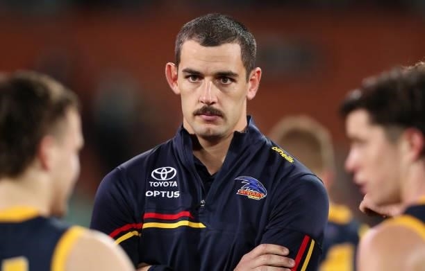 Taylor Walker of the Crows at looks on during the third quarter after suffering a neck injury during the 2021 AFL Round 16 match between the Adelaide...