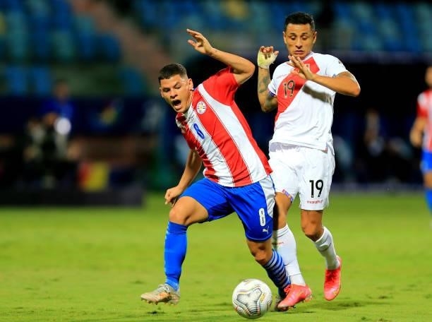 Richard Sanchez of Paraguay competes for the ball against Yoshimar Yotun of Peru during the Quarterfinal match between Peru and Paraguay as part of...