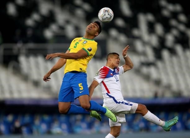 Casemiro of Brazil head the ball against Alexis Sanchez of Chile ,during the Quarterfinal match between Brazil and Chile as part of Conmebol Copa...