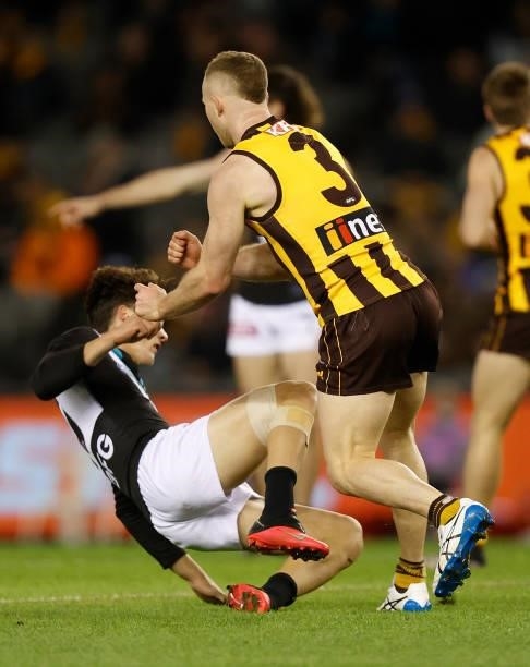 Tom Mitchell of the Hawks pushes Connor Rozee of the Power during the 2021 AFL Round 16 match between the Hawthorn Hawks and the Port Adelaide Power...