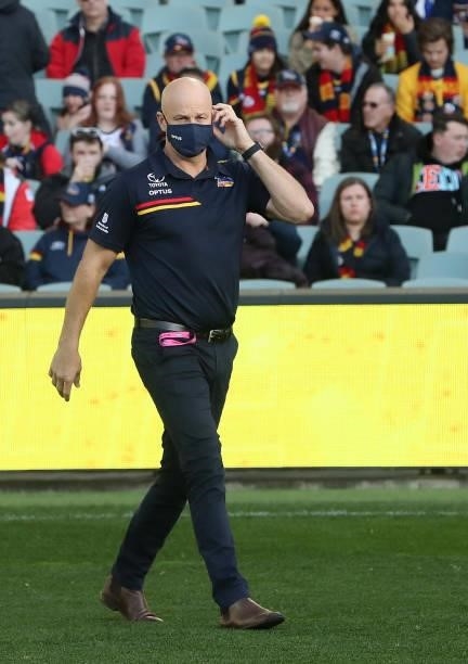 Matthew Nicks, Senior Coach of the Crows walks out onto the oval during the 2021 AFL Round 16 match between the Adelaide Crows and the Brisbane Lions...
