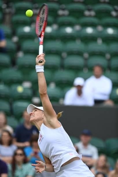 Germany's Angelique Kerber serves against Belarus' Aliaksandra Sasnovich during their women's singles third round match on the sixth day of the 2021...