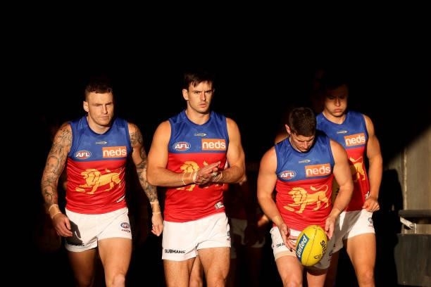 The Lions run out during the 2021 AFL Round 16 match between the Adelaide Crows and the Brisbane Lions at Adelaide Oval on July 3, 2021 in Adelaide,...