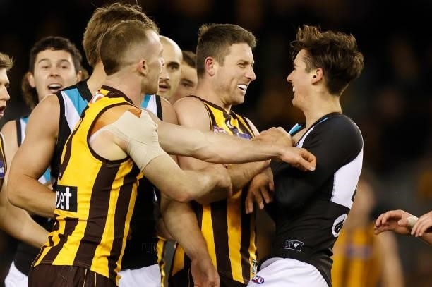 Liam Shiels of the Hawks and Connor Rozee of the Power clash during the 2021 AFL Round 16 match between the Hawthorn Hawks and the Port Adelaide...