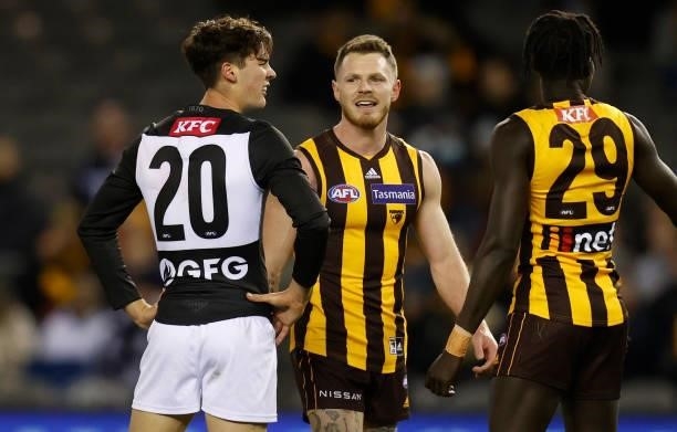Connor Rozee of the Power and Blake Hardwick of the Hawks exchange words during the 2021 AFL Round 16 match between the Hawthorn Hawks and the Port...