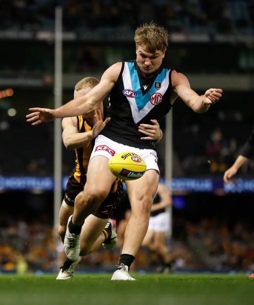 Ollie Wines of the Power kicks the ball during the 2021 AFL Round 16 match between the Hawthorn Hawks and the Port Adelaide Power at Marvel Stadium...