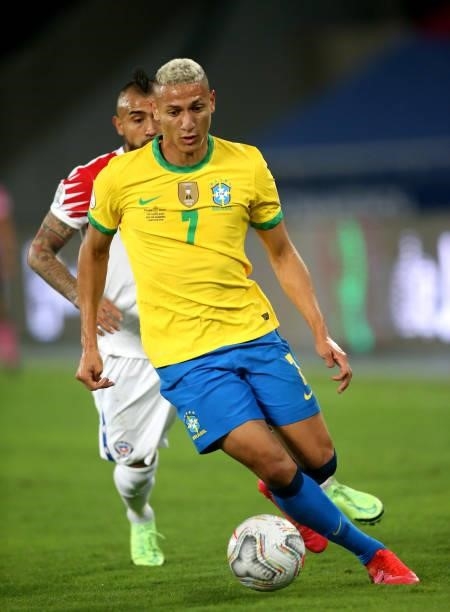 Richarlison of Brazil competes for the ball with Arturo Vidal of Chile ,during the Quarterfinal match between Brazil and Chile as part of Conmebol...