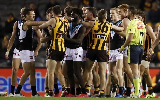Players remonstrate during the 2021 AFL Round 16 match between the Hawthorn Hawks and the Port Adelaide Power at Marvel Stadium on July 3, 2021 in...