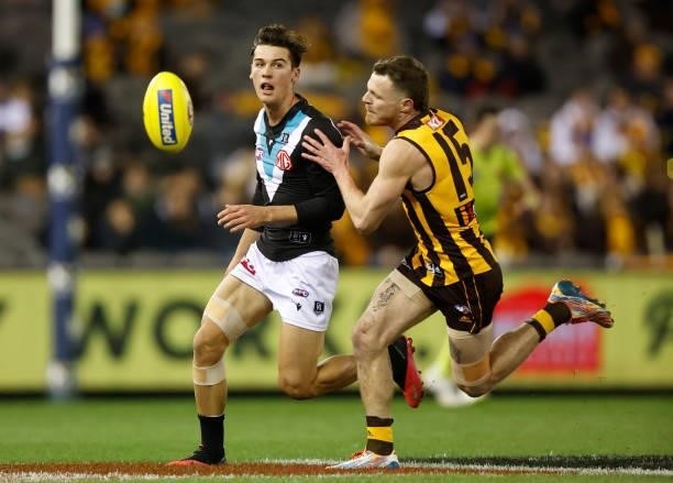 Connor Rozee of the Power and Blake Hardwick of the Hawks compete for the ball during the 2021 AFL Round 16 match between the Hawthorn Hawks and the...