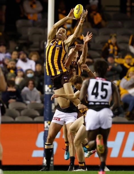 Jonathon Ceglar of the Hawks attempts a high mark over Scott Lycett of the Power during the 2021 AFL Round 16 match between the Hawthorn Hawks and...