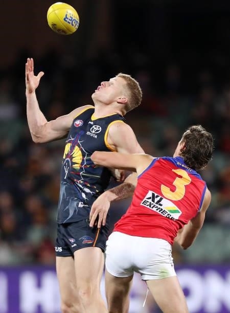 Reilly O'Brien of the Crows and Joe Daniher of the Lions during the 2021 AFL Round 16 match between the Adelaide Crows and the Brisbane Lions at...