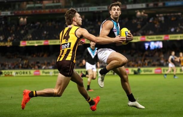 Sam Mayes of the Power and Jack Scrimshaw of the Hawks compete for the ball during the 2021 AFL Round 16 match between the Hawthorn Hawks and the...