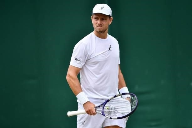Australia's James Duckworth reacts against Italy's Lorenzo Sonego during their men's singles third round match on the sixth day of the 2021 Wimbledon...