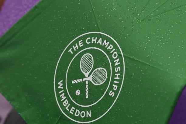 Rain drops on a Wimbledon umbrella as rain stops play on the sixth day of the 2021 Wimbledon Championships at The All England Tennis Club in...
