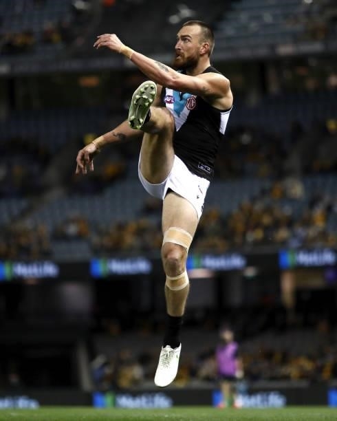 Charlie Dixon of the Power kicks the ball during the 2021 AFL Round 16 match between the Hawthorn Hawks and the Port Adelaide Power at Marvel Stadium...