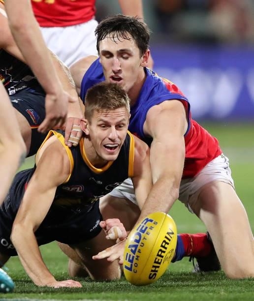 David Mackay of the Crows and Oscar McInerney of the Lions during the 2021 AFL Round 16 match between the Adelaide Crows and the Brisbane Lions at...