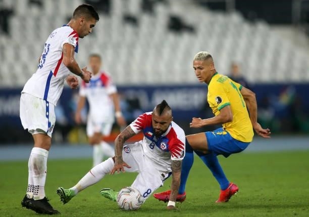 Arturo Vidal of Chile competes for the ball with Richarlison of Brazil ,during the Quarterfinal match between Brazil and Chile as part of Conmebol...