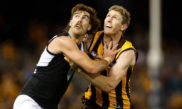 Scott Lycett of the Power and Ben McEvoy of the Hawks compete in a ruck contest during the 2021 AFL Round 16 match between the Hawthorn Hawks and the...