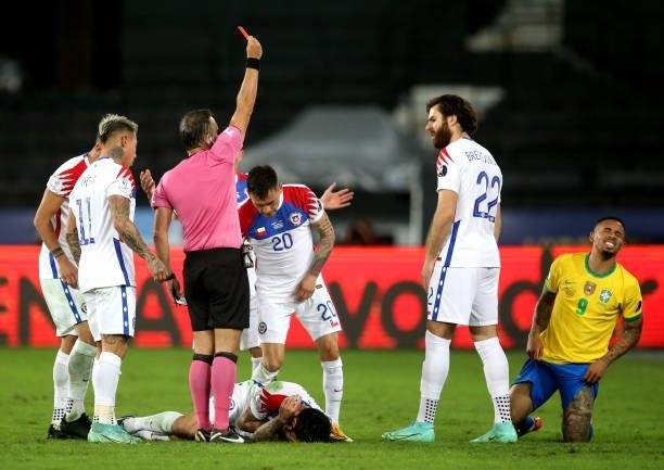 The referee Patricio Hernan Loustau shows the red card for Gabriel Jesus of Brazil ,during the Quarterfinal match between Brazil and Chile as part of...
