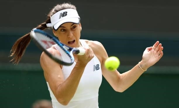 Romania's Sorana Cirstea returns against Britain's Emma Raducanu during their women's singles third round match on the sixth day of the 2021...