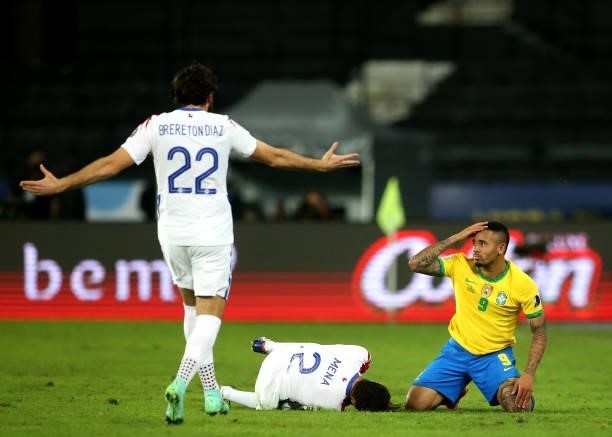 Gabriel Jesus of Brazil with Eugenio Mena of Chile Ref card foul ,during the Quarterfinal match between Brazil and Chile as part of Conmebol Copa...