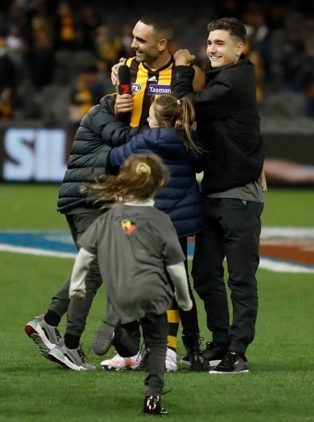 Shaun Burgoyne of the Hawks is embraced after his 400th match by children Percy, Ky, Nixie and Leni during the 2021 AFL Round 16 match between the...