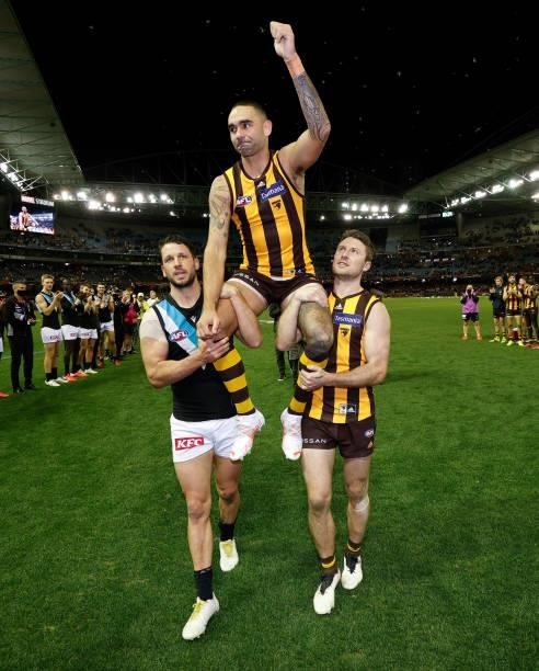 Shaun Burgoyne of the Hawks is chaired from the field after his 400th match by Travis Boak of the Power and Liam Shiels of the Hawks during the 2021...