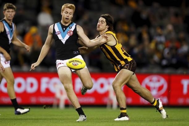 Willem Drew of the Power is pushed by Jai Newcombe of the Hawks during the 2021 AFL Round 16 match between the Hawthorn Hawks and the Port Adelaide...
