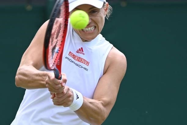 Germany's Angelique Kerber returns against Belarus' Aliaksandra Sasnovich during their women's singles third round match on the sixth day of the 2021...