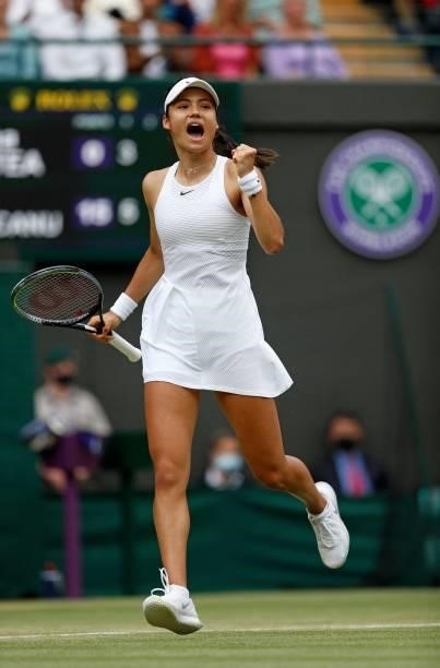 Britain's Emma Raducanu celebrates winning a point against Romania's Sorana Cirstea during their women's singles third round match on the sixth day...