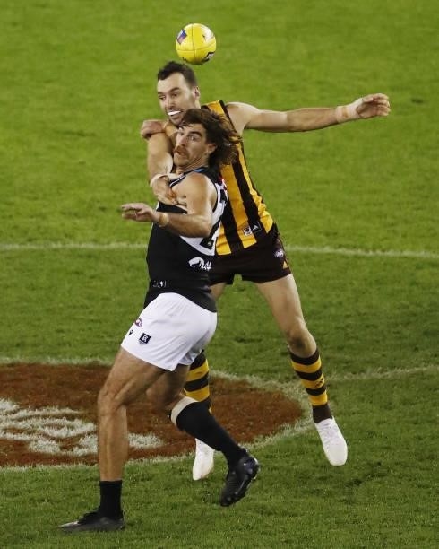 Scott Lycett of the Power and Jonathon Ceglar of the Hawks compete for the ball during the 2021 AFL Round 16 match between the Hawthorn Hawks and the...