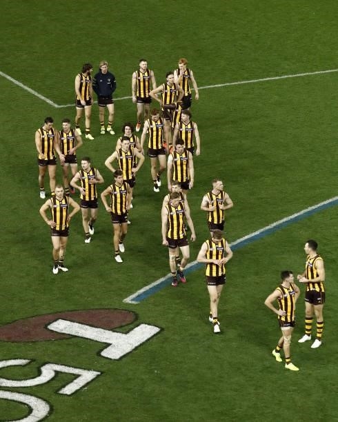 Hawthorn players leave the field after a loss during the 2021 AFL Round 16 match between the Hawthorn Hawks and the Port Adelaide Power at Marvel...