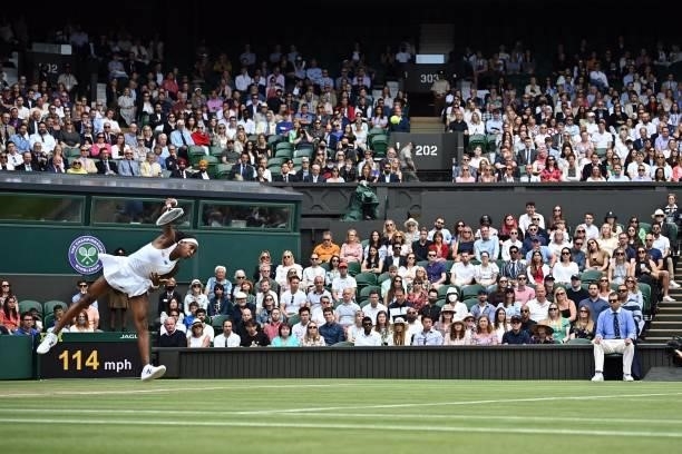 Player Coco Gauff serves against Slovenia's Kaja Juvan during their women's singles third round match on the sixth day of the 2021 Wimbledon...
