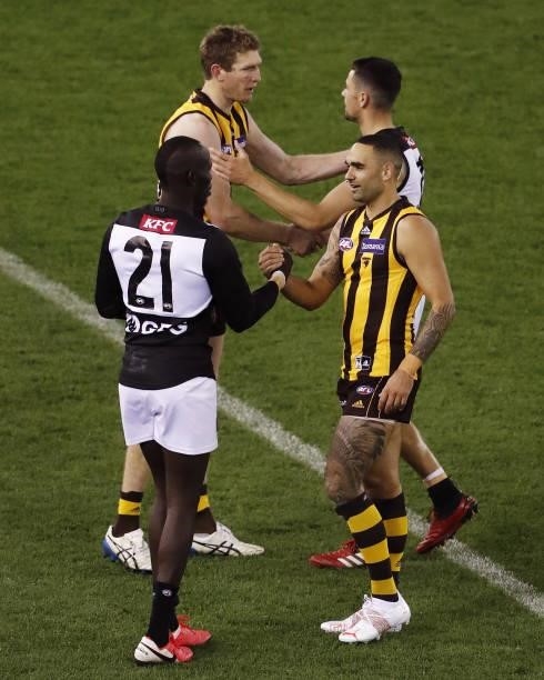 Shaun Burgoyne of the Hawks shakes hands with Aliir Aliir of the Power during the 2021 AFL Round 16 match between the Hawthorn Hawks and the Port...