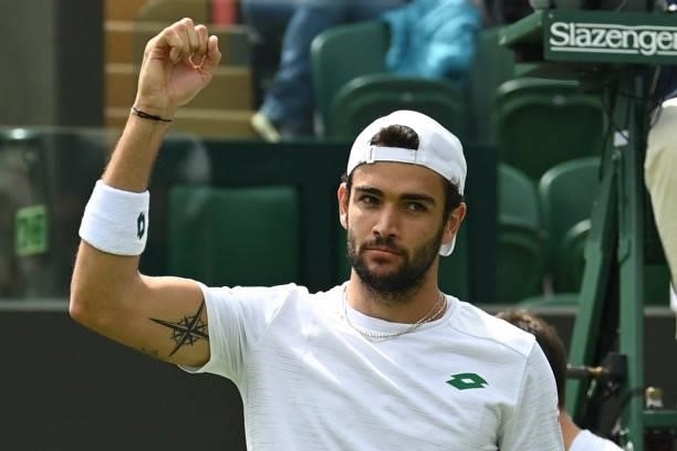 Italy's Matteo Berrettini celebrates after beating Slovenia's Aljaz Bedene during their men's singles third round match on the sixth day of the 2021...