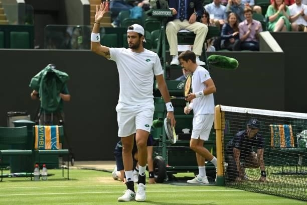 Italy's Matteo Berrettini celebrates after beating Slovenia's Aljaz Bedene during their men's singles third round match on the sixth day of the 2021...