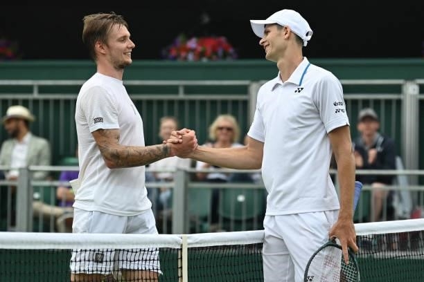 Poland's Hubert Hurkacz shakes hands with Kazakhstan's Alexander Bublik after wining their men's singles third round match on the sixth day of the...