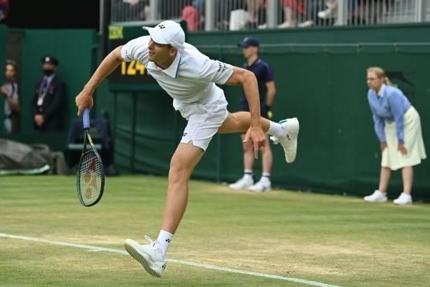 Poland's Hubert Hurkacz serves to Kazakhstan's Alexander Bublik during their men's singles third round match on the sixth day of the 2021 Wimbledon...