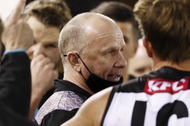 Ken Hinkley, Senior Coach of the Power addresses his players during the 2021 AFL Round 16 match between the Hawthorn Hawks and the Port Adelaide...
