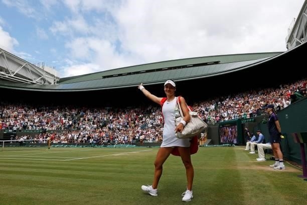Britain's Emma Raducanu waves to the fans as she leaves the court after winning against Romania's Sorana Cirstea during their women's singles third...