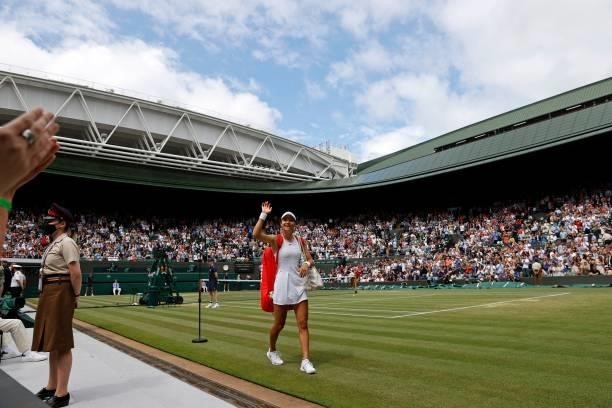 Britain's Emma Raducanu waves to the fans as she leaves the court after winning against Romania's Sorana Cirstea during their women's singles third...