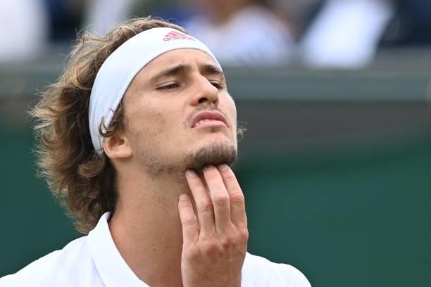 Germany's Alexander Zverev reacts while playing US player Taylor Fritz during their men's singles third round match on the sixth day of the 2021...